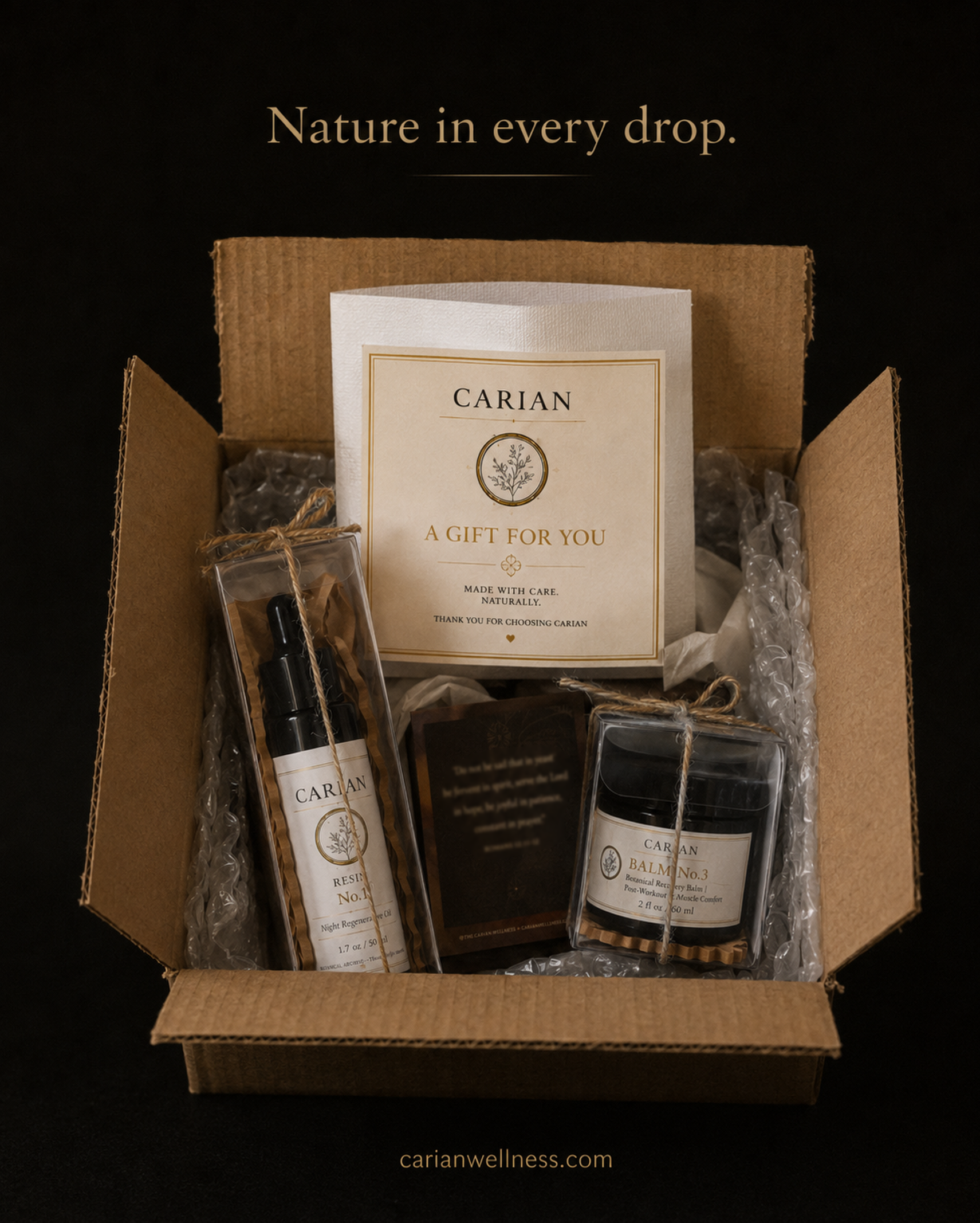 An open kraft gift box with a CARIAN thank-you card reading "A gift for you," containing a boxed RESIN No.1 dropper bottle and a BALM No.3 jar tied with twine, nestled in packaging. Gold text above reads "Nature in every drop."